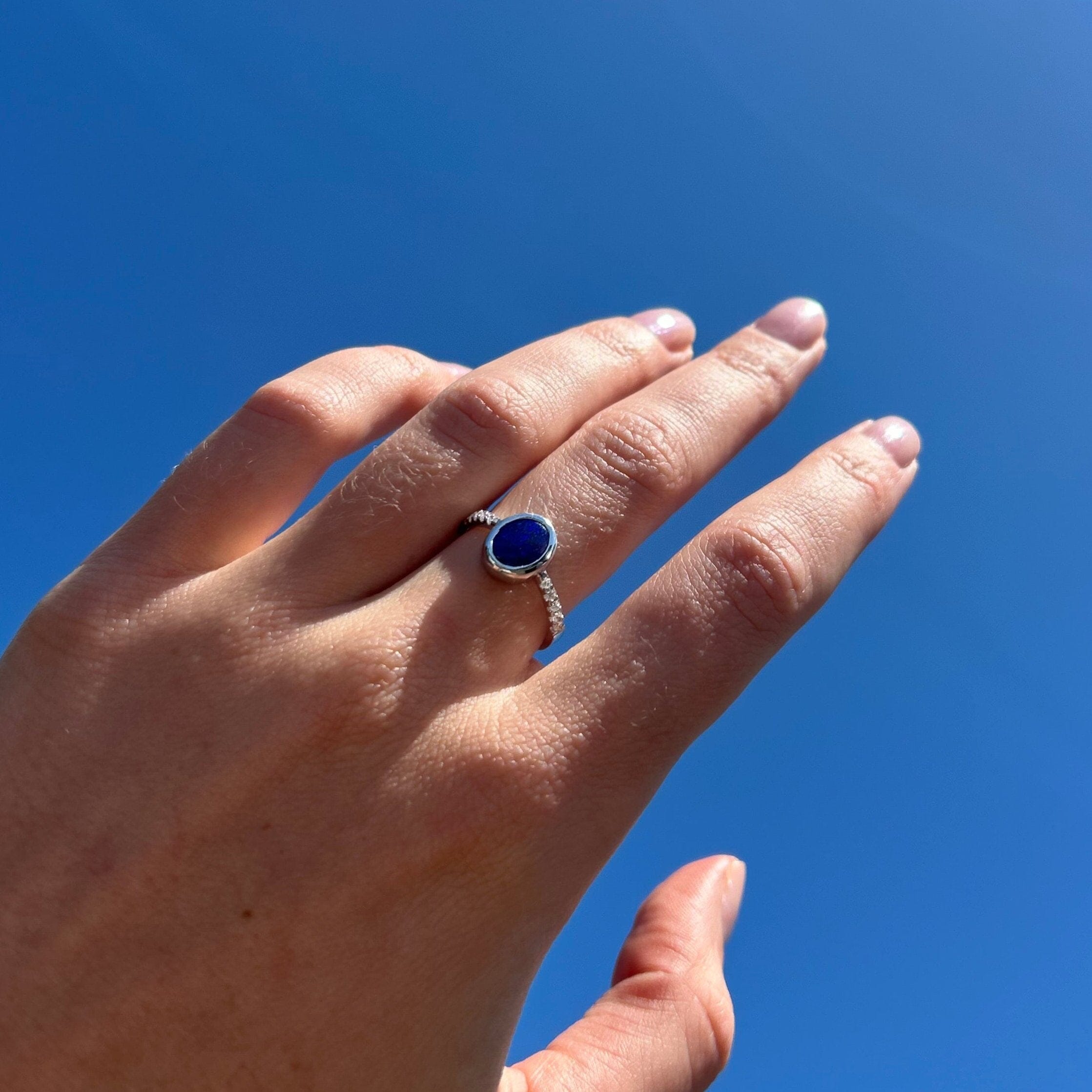 opal ring on model hand