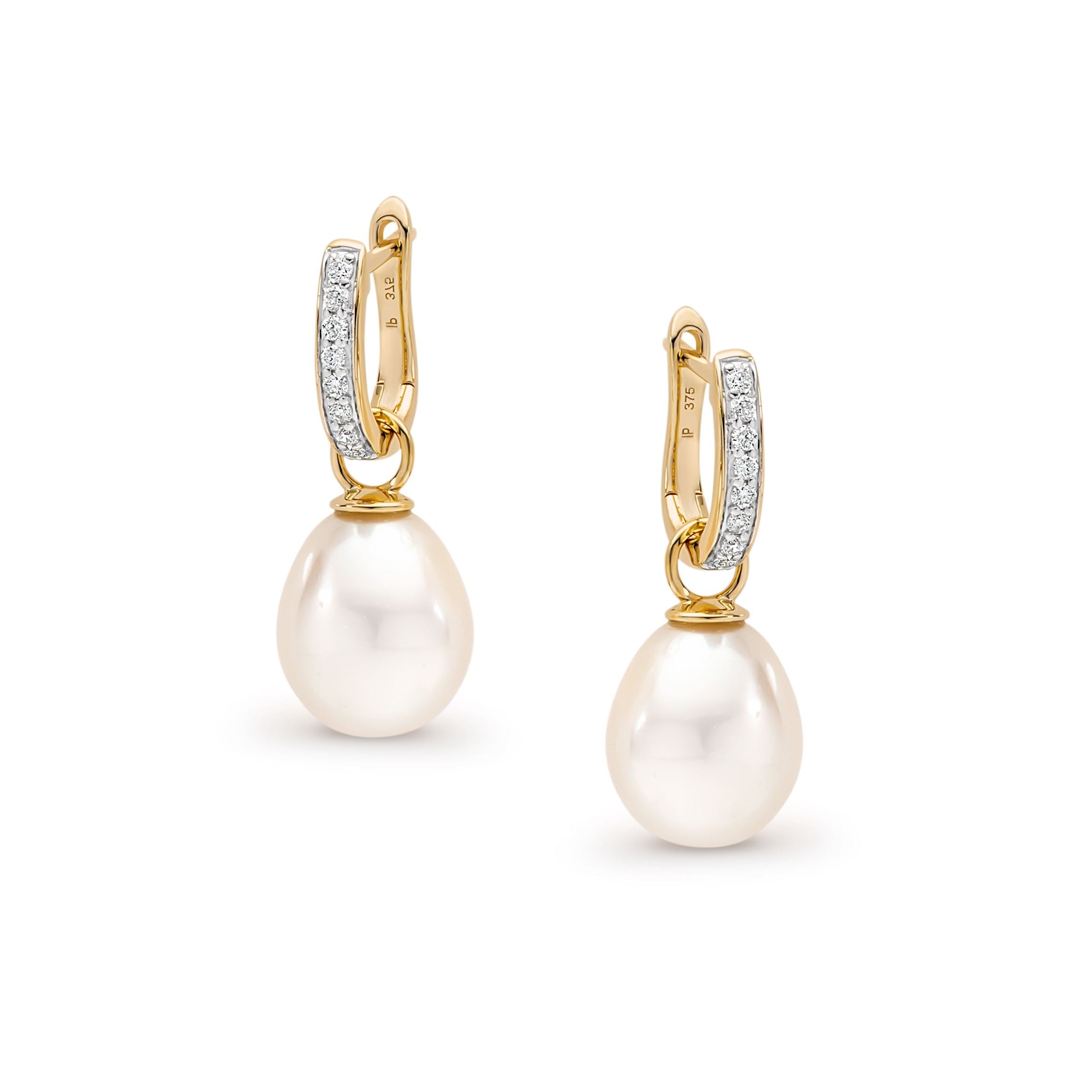 Pair of pearl huggie earrings with gold and diamond accents on a white background | Ikecho Australia