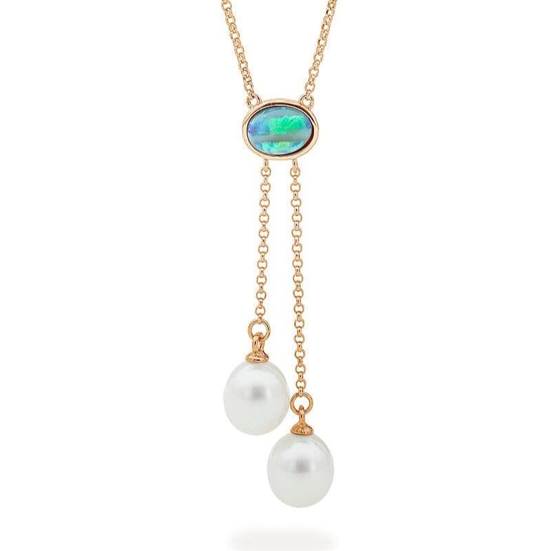 A lariat-style necklace with a solid light opal centerpiece and two drop-shaped cultured freshwater pearls, crafted in 9ct yellow gold.