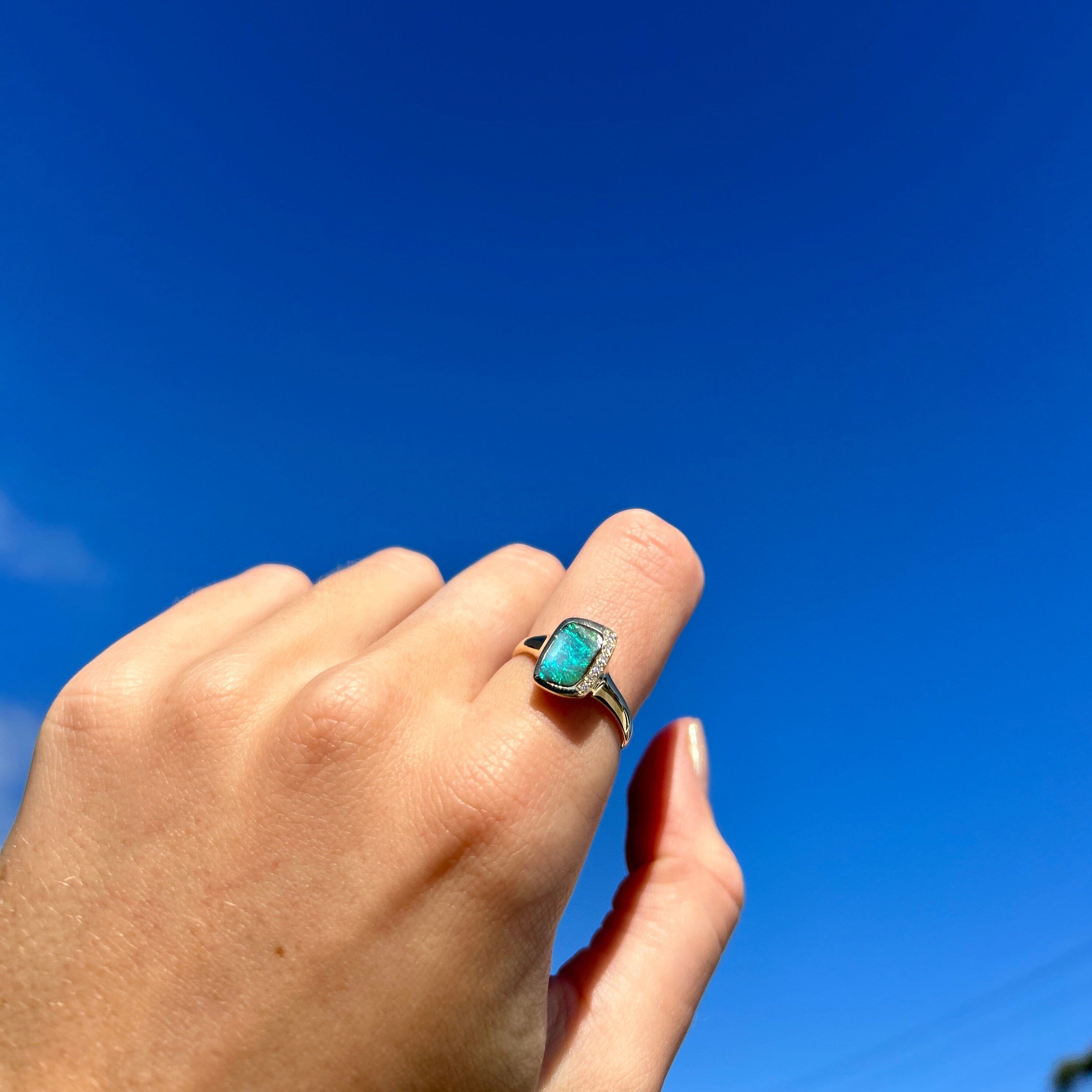 Close up of hand wearing green Australian opal ring | Ikecho Australia