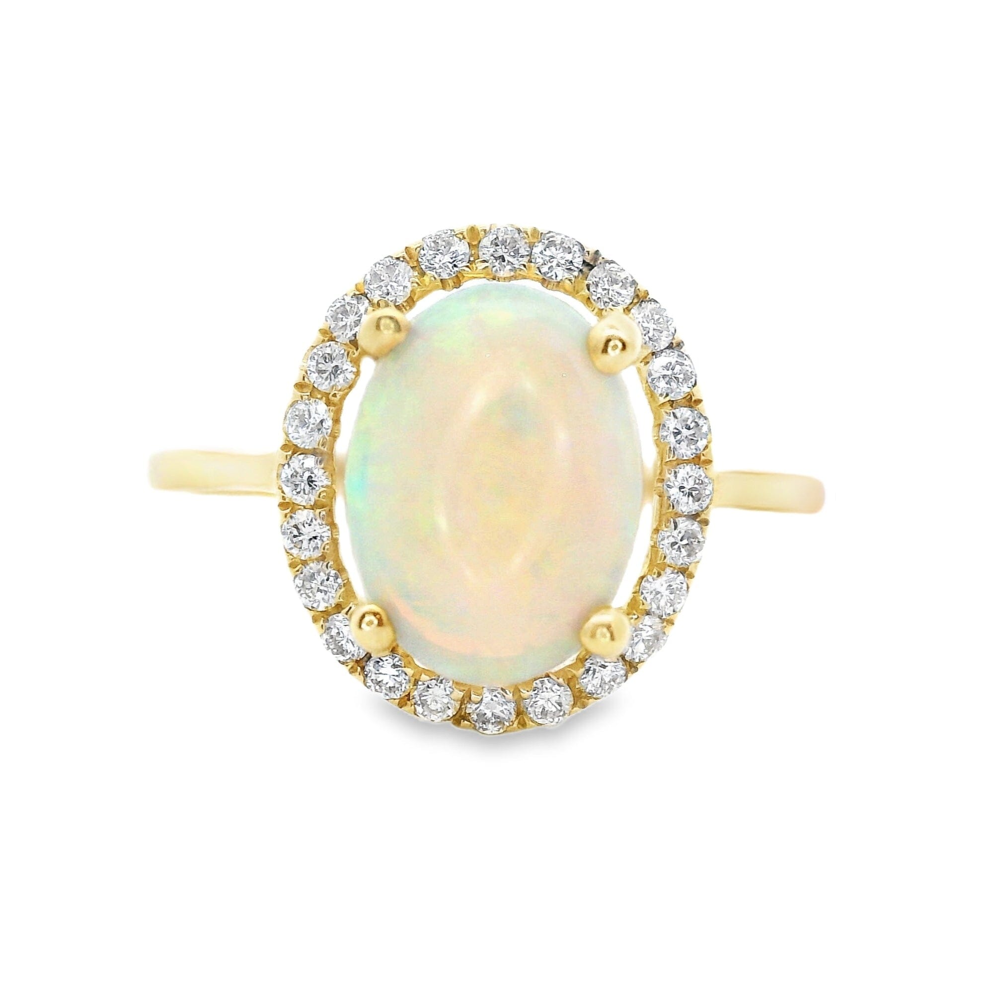 Gold ring with an opal stone and diamond accents on a white background